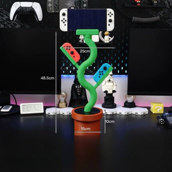 Cannibal flower game console stand holding Nintendo Switch with game card slots and USB base