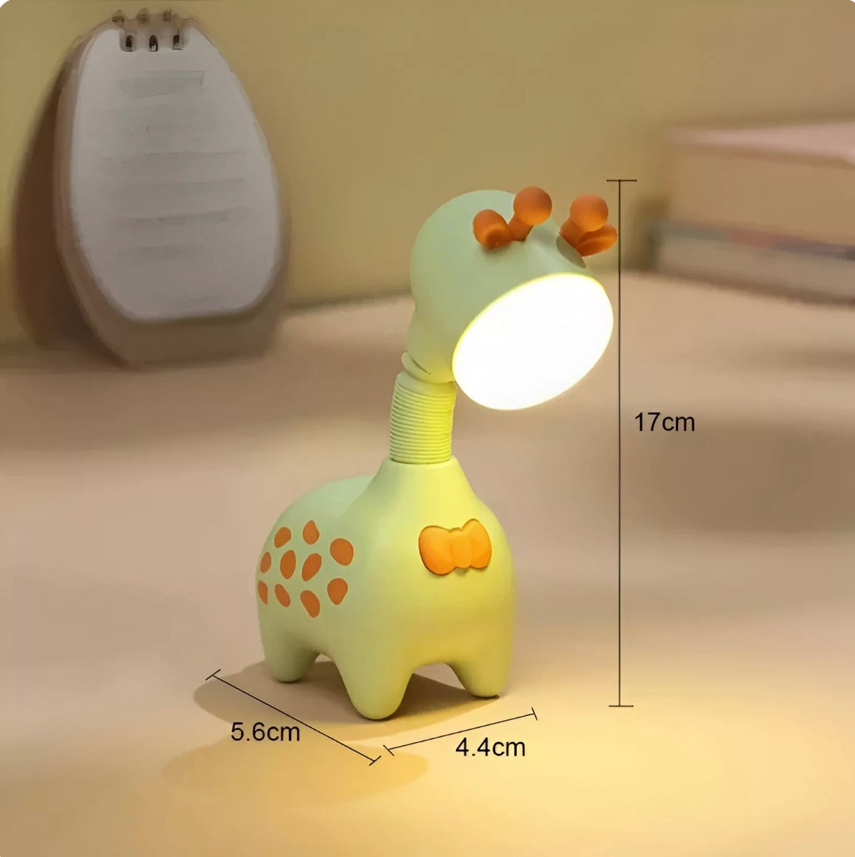 Giraffe-shaped rechargeable LED night light in pink, green, and beige with telescopic neck design