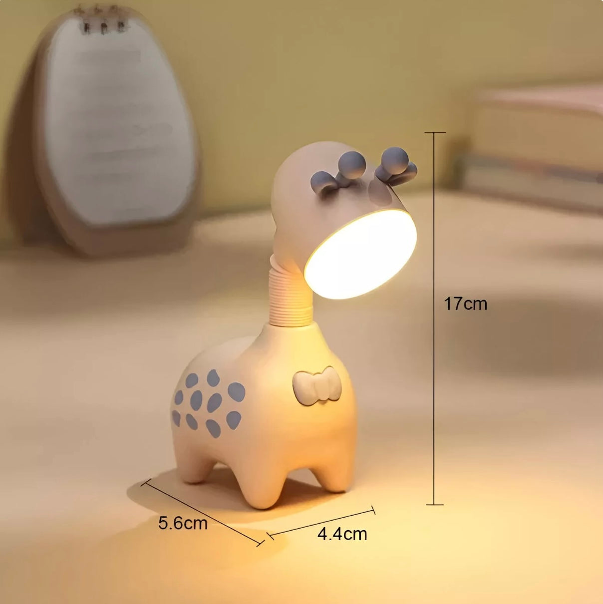 Giraffe-shaped rechargeable LED night light in pink, green, and beige with telescopic neck design