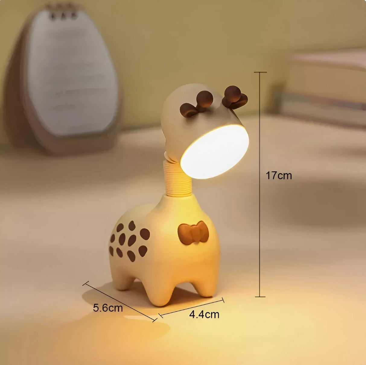 Giraffe-shaped rechargeable LED night light in pink, green, and beige with telescopic neck design